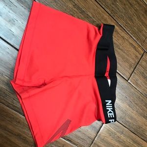 Red Nike shorts